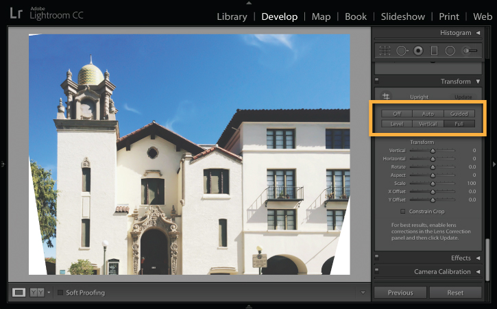 Adobe Lightroom screenshot with Upright controls outlined in orange and blank areas visible at the lower edges of the transformed building photo.