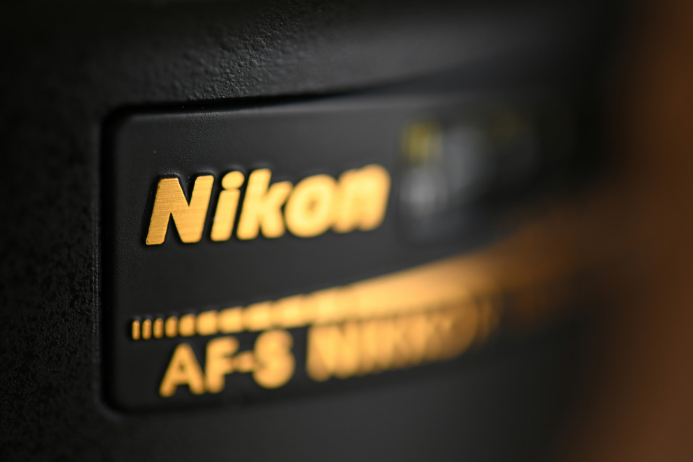 Nikon’s single-frame example with only part of the angled lens nameplate in focus