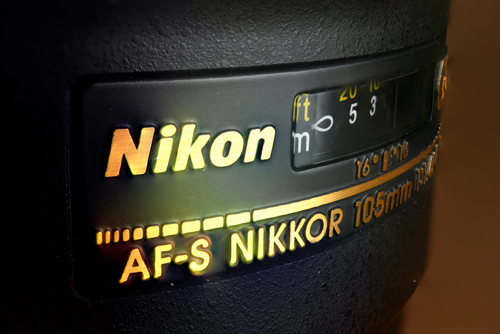 Nikon’s stacked example with more of the lens lettering and distance window readable