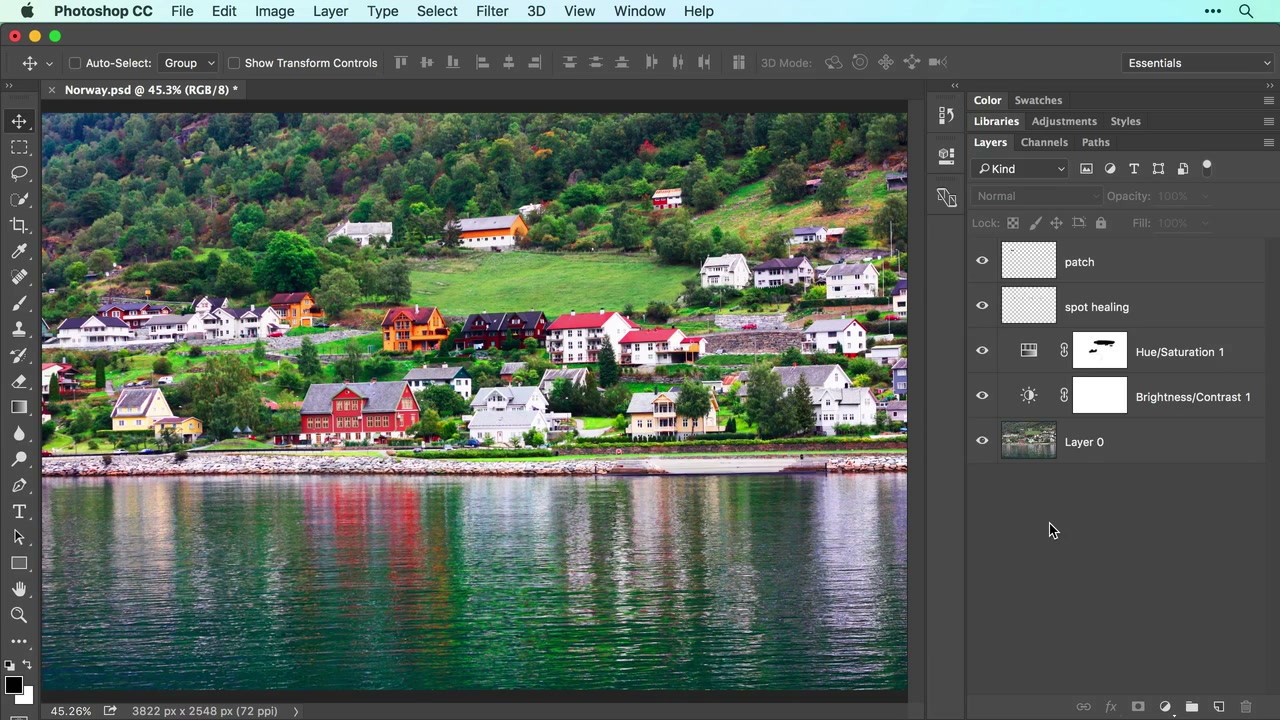 Adobe lesson frame of an already edited Norwegian village photograph before the Tilt-Shift Blur demonstration