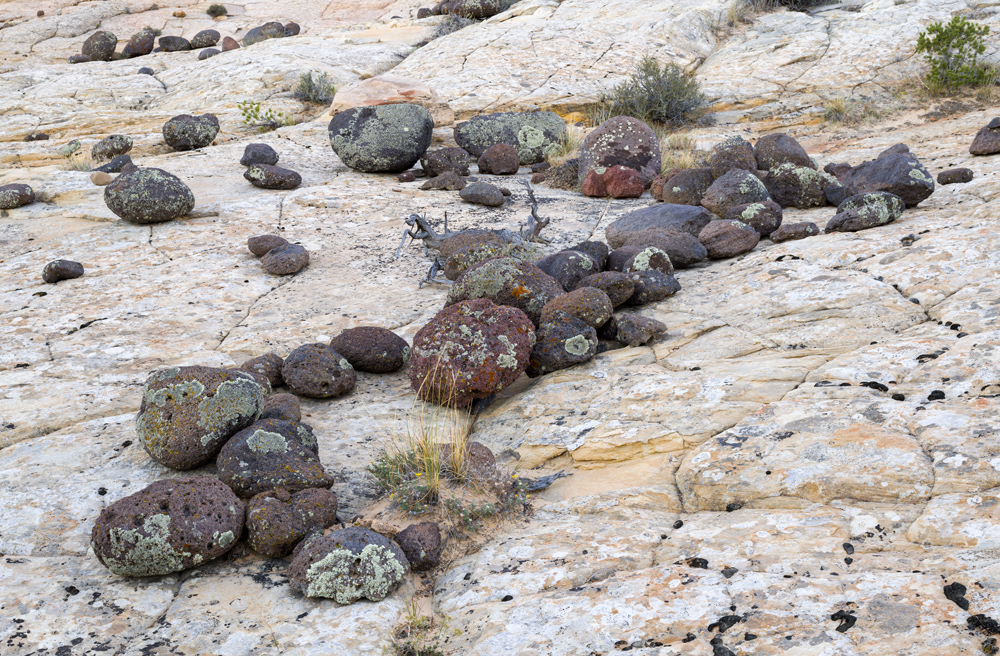 John Shaw photograph of rocks across a sloping pale stone surface at Grand Staircase-Escalante